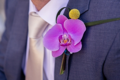 Orchid, craspedia and bear brass buttonhole