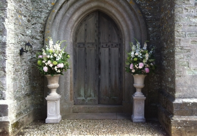 Classic urns filled with pink and white flowers
